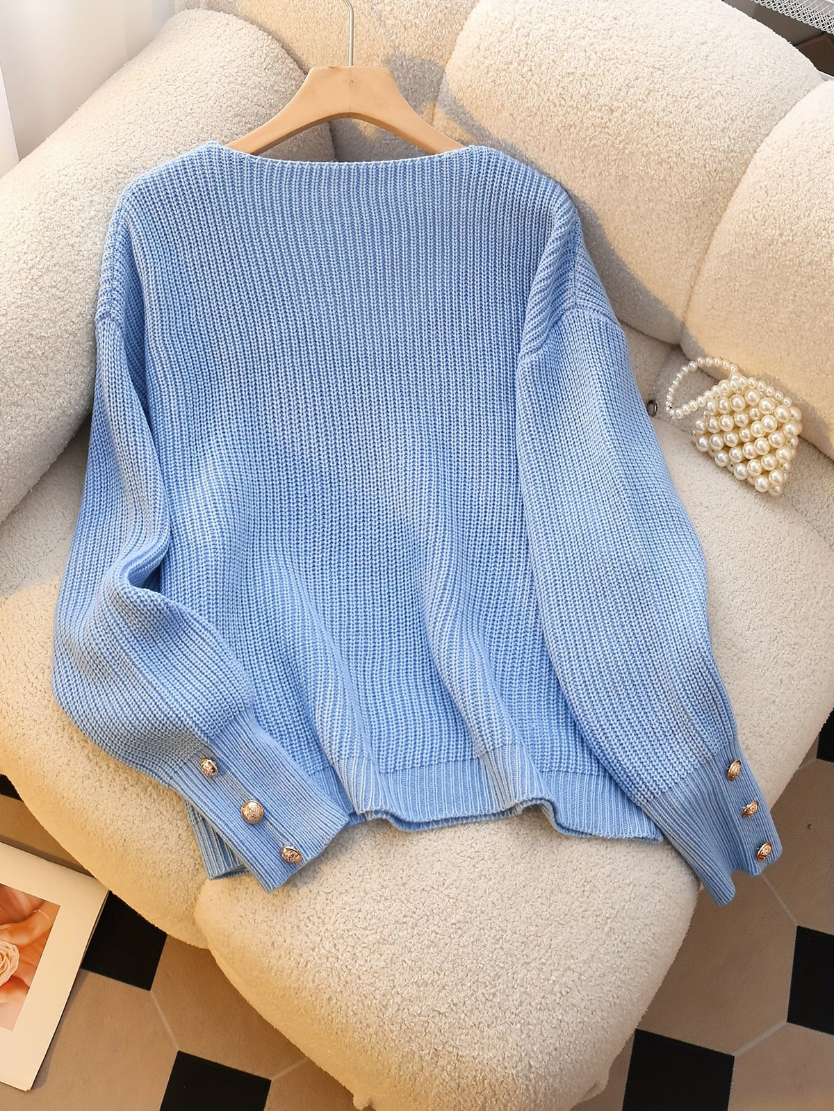 Bettina V-neck sweater flat lay - Sky Blue