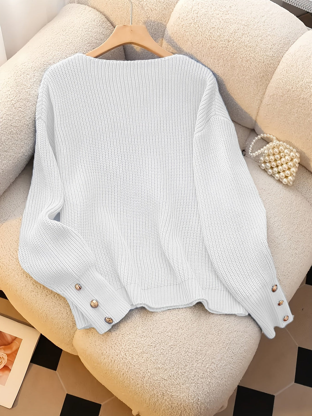 Bettina V-neck sweater flat lay - White