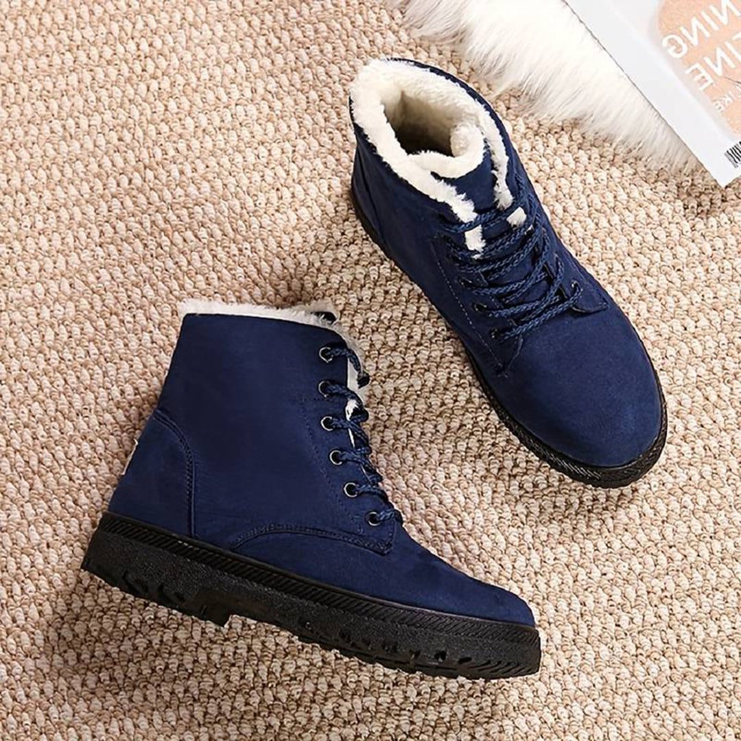 Blue women's plush-lined lace-up ankle boots, angled view