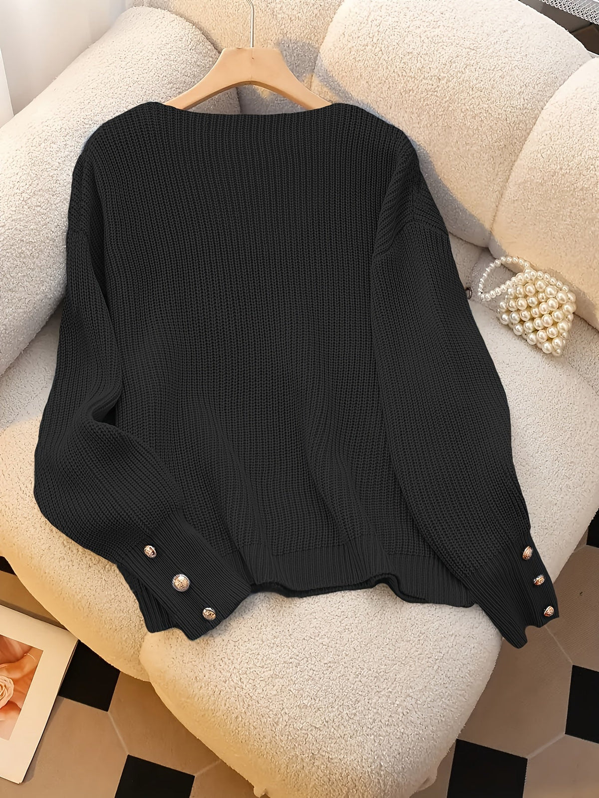 Bettina V-neck sweater flat lay - Black