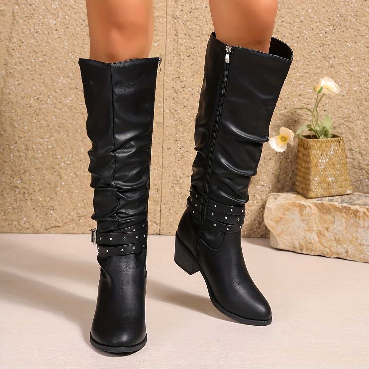 Women's black slouchy knee-high boots front view